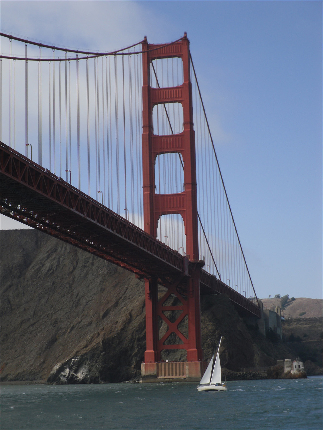 Golden Gate Bridge north tower with sailboat